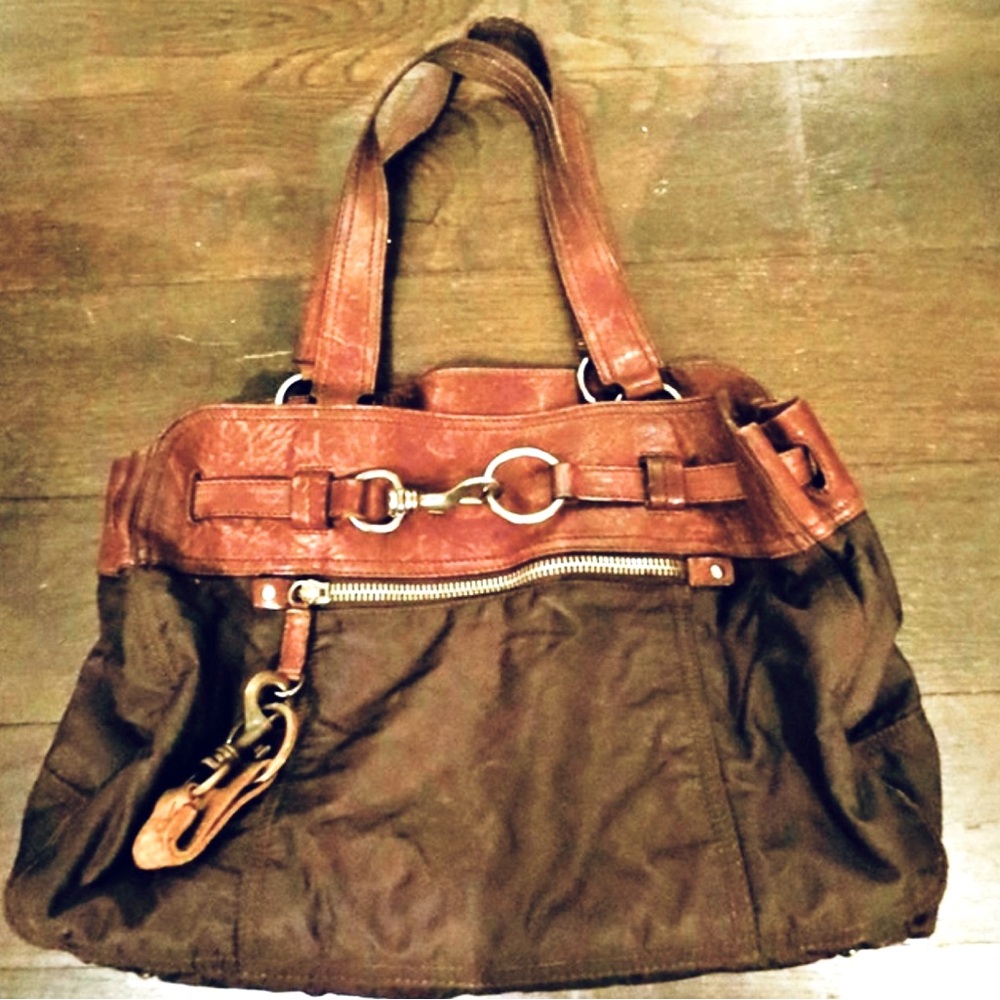 Gorgeous Miu Miu leather trimmed bag with cool hardware. Excellent condition